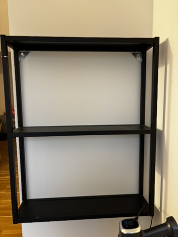 Black wall-mounted shelf